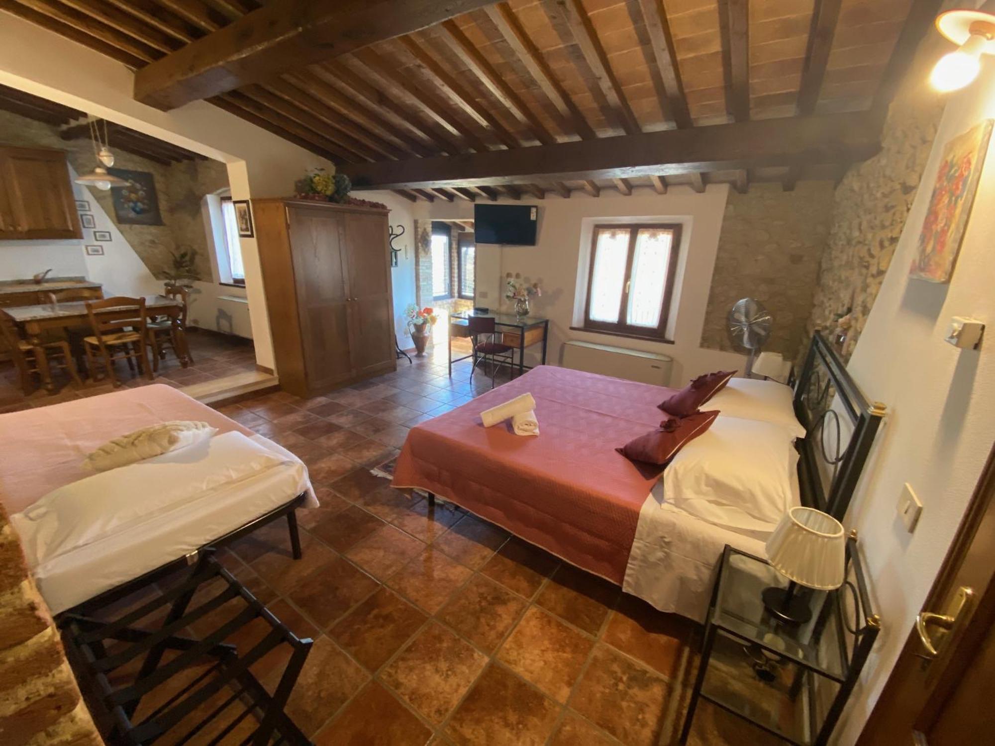 Casa Vacanze Etrusco Сан Джиминяно Стая снимка